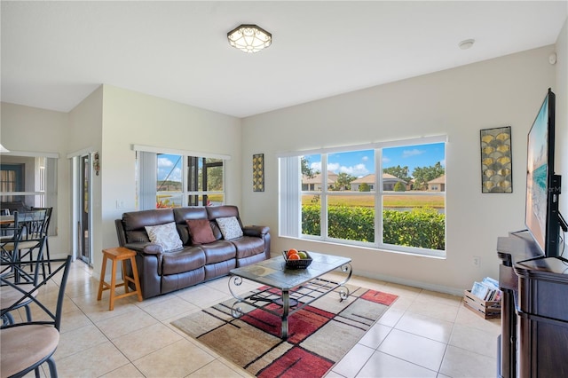 2641 Meadow View Ct, Kissimmee, FL 34746 - living room with light tile patterned floors and baseboards