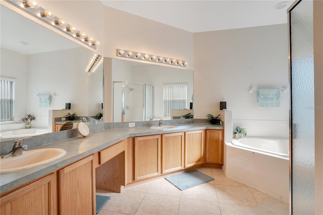 2641 Meadow View Ct, Kissimmee, FL 34746 - full bathroom featuring a stall shower, double vanity, a bath, and tile patterned floors