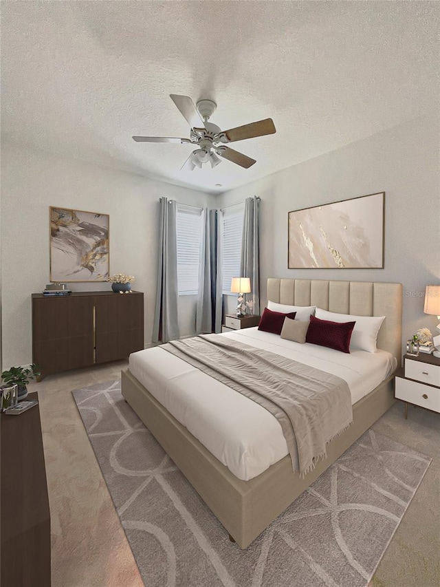 carpeted bedroom featuring ceiling fan and a textured ceiling