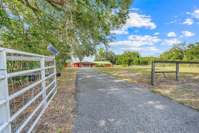 274 W Kings Hwy, Center Hill, FL 33514 - view of road with a gated entry and aphalt driveway