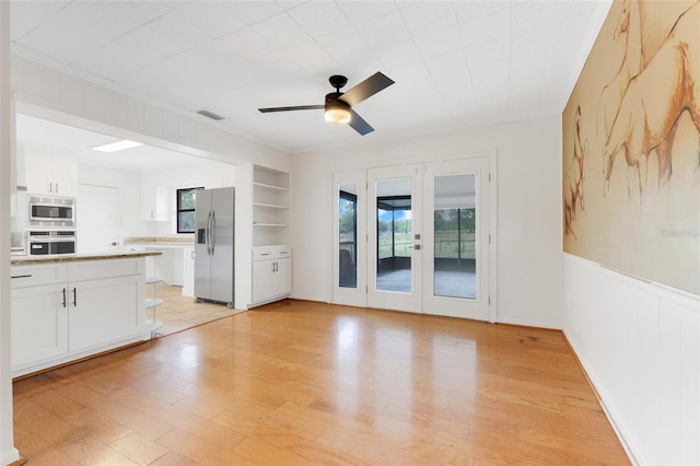 274 W Kings Hwy, Center Hill, FL 33514 - unfurnished living room with crown molding, ceiling fan, light wood-style floors, french doors, and visible vents