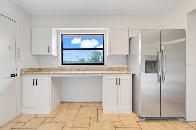 274 W Kings Hwy, Center Hill, FL 33514 - kitchen with crown molding, stainless steel refrigerator with ice dispenser, stone tile floors, and white cabinetry