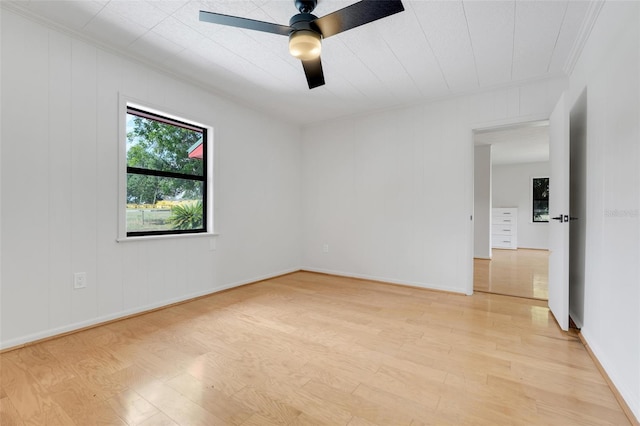 274 W Kings Hwy, Center Hill, FL 33514 - empty room featuring crown molding, a ceiling fan, baseboards, and light wood finished floors