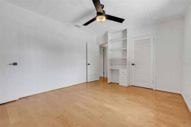 274 W Kings Hwy, Center Hill, FL 33514 - unfurnished bedroom featuring crown molding, wood finished floors, and visible vents