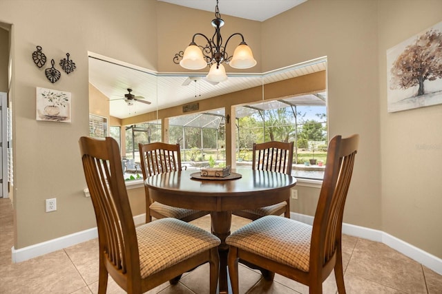 dining room with baseboards, ceiling fan, and light tile patterned flooring