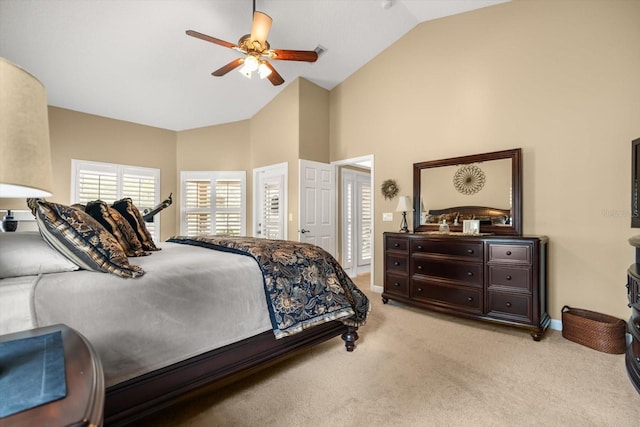 bedroom with baseboards, high vaulted ceiling, light carpet, and ceiling fan
