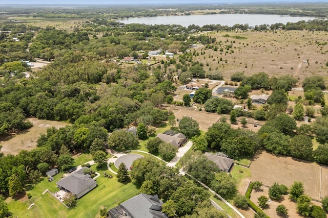 bird's eye view featuring a water view and a wooded view