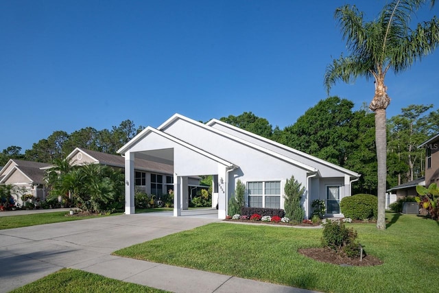 2539 Caithness Way, Clermont, FL 34714 - ranch-style house featuring a carport, a front lawn, driveway, and stucco siding