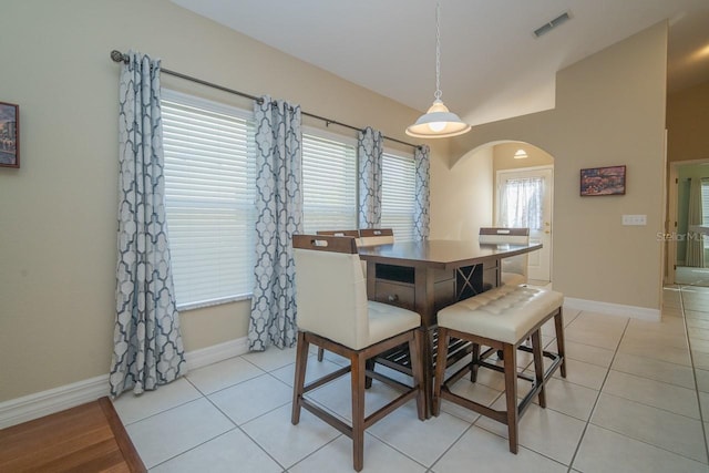 2539 Caithness Way, Clermont, FL 34714 - dining area featuring arched walkways, baseboards, and light tile patterned floors