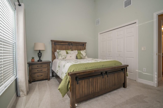 2539 Caithness Way, Clermont, FL 34714 - carpeted bedroom featuring a closet, baseboards, and a high ceiling