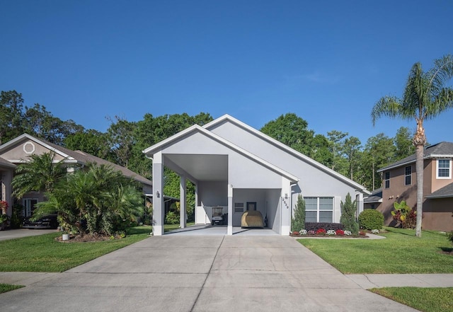 2539 Caithness Way, Clermont, FL 34714 - view of front facade with a front lawn, driveway, and stucco siding