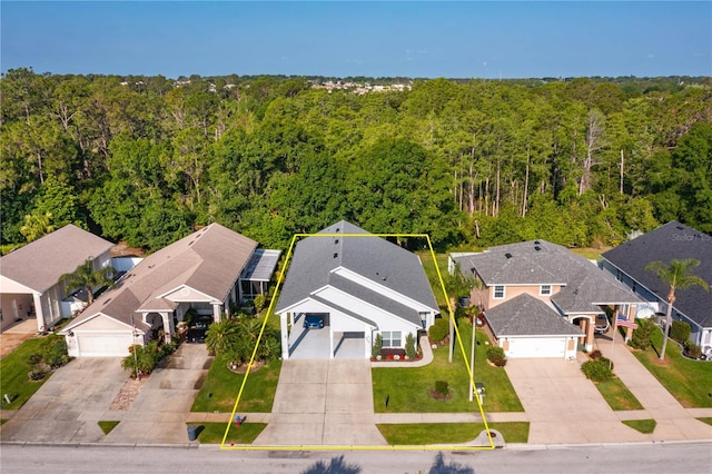 2539 Caithness Way, Clermont, FL 34714 - aerial view of residential area featuring a heavily wooded area and property boundaries highlighted
