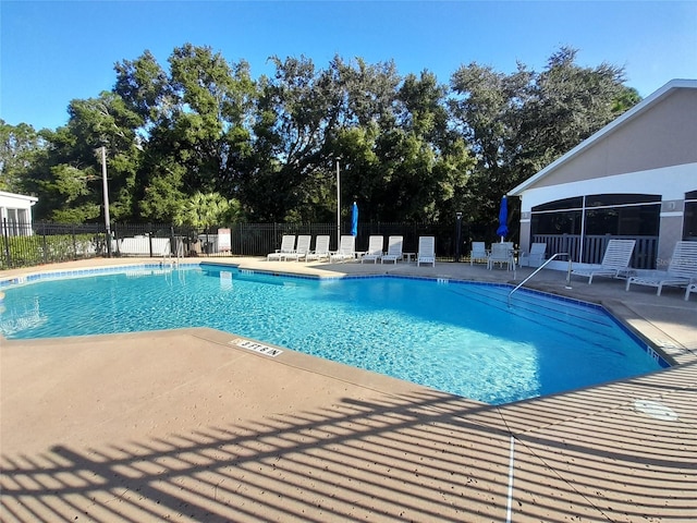 2539 Caithness Way, Clermont, FL 34714 - community pool featuring a patio area and view of wooded area
