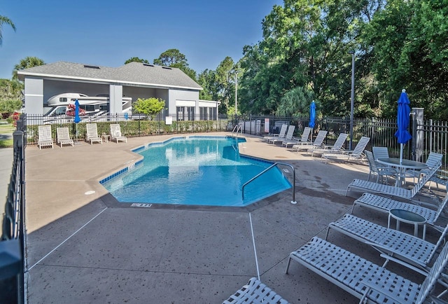 2539 Caithness Way, Clermont, FL 34714 - community pool with a patio and view of wooded area