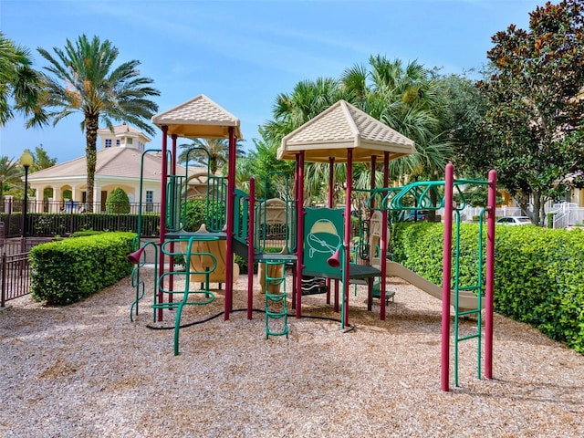 community jungle gym featuring fence
