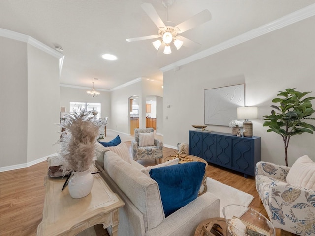 951 Chapman Loop, The Villages, FL 32162 - living area with wood finished floors, ornamental molding, arched walkways, baseboards, and ceiling fan