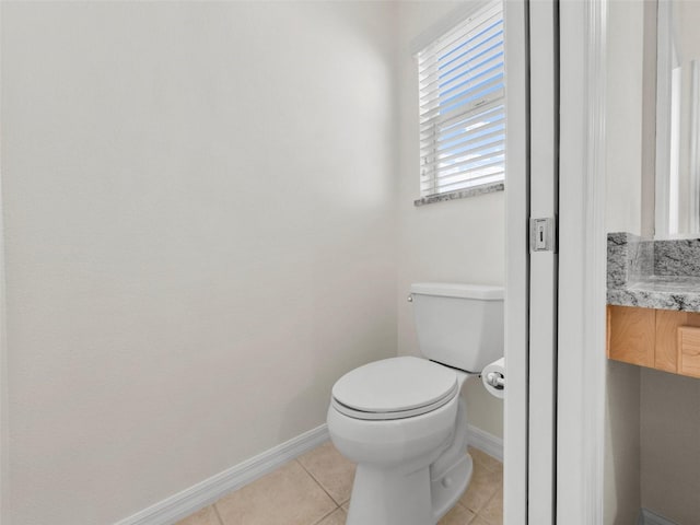 951 Chapman Loop, The Villages, FL 32162 - bathroom featuring baseboards, tile patterned floors, and toilet