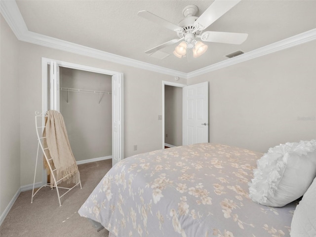 951 Chapman Loop, The Villages, FL 32162 - bedroom with carpet floors, ornamental molding, a closet, a ceiling fan, and baseboards