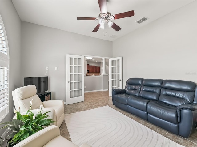 living area with a ceiling fan, tile patterned flooring, french doors, and visible vents