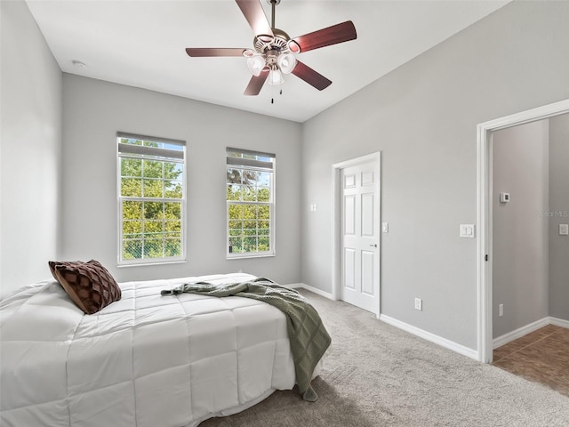 bedroom with carpet floors, baseboards, and ceiling fan