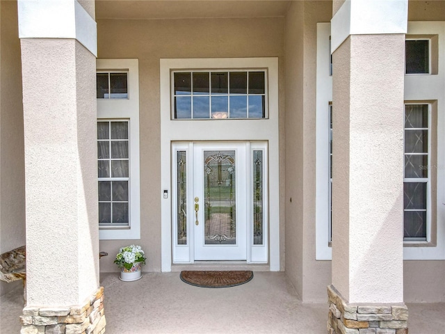 1473 Lakemist Ln, Clermont, FL 34711 - property entrance with stucco siding and stone siding