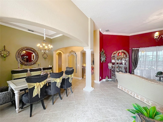 1473 Lakemist Ln, Clermont, FL 34711 - dining room featuring visible vents, crown molding, decorative columns, arched walkways, and light tile patterned floors