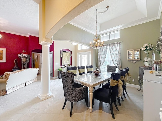 1473 Lakemist Ln, Clermont, FL 34711 - dining room with arched walkways, ornate columns, a textured ceiling, and a wealth of natural light