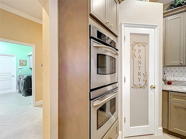 1473 Lakemist Ln, Clermont, FL 34711 - kitchen with crown molding, light stone countertops, stainless steel double oven, gray cabinets, and backsplash