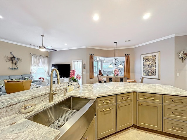 1473 Lakemist Ln, Clermont, FL 34711 - kitchen with a ceiling fan, ornamental molding, light stone countertops, open floor plan, and a sink