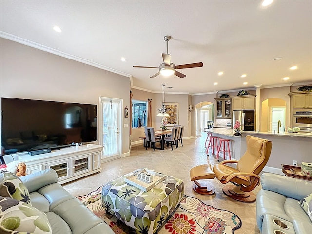 1473 Lakemist Ln, Clermont, FL 34711 - living room with arched walkways, baseboards, a ceiling fan, and recessed lighting