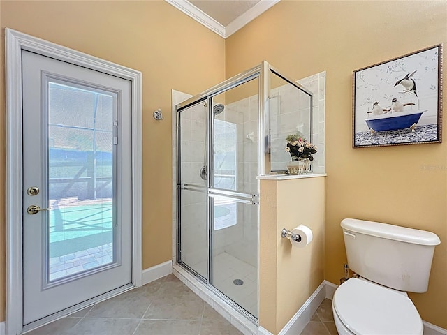 1473 Lakemist Ln, Clermont, FL 34711 - bathroom with crown molding, tile patterned floors, baseboards, and a stall shower