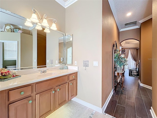 1473 Lakemist Ln, Clermont, FL 34711 - bathroom with crown molding, baseboards, visible vents, and vanity