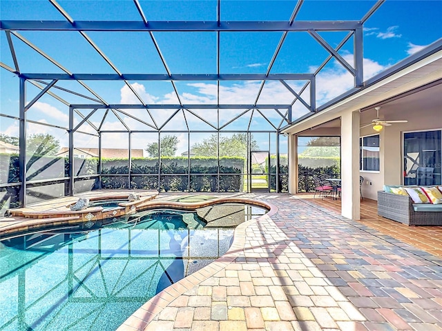 1473 Lakemist Ln, Clermont, FL 34711 - view of swimming pool featuring a ceiling fan, glass enclosure, a pool with connected hot tub, and a patio area