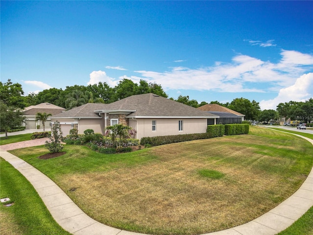 1473 Lakemist Ln, Clermont, FL 34711 - view of property exterior featuring a garage, stucco siding, a yard, and driveway