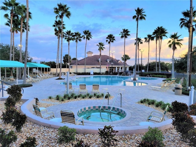 1473 Lakemist Ln, Clermont, FL 34711 - community pool featuring a patio, fence, and a community hot tub