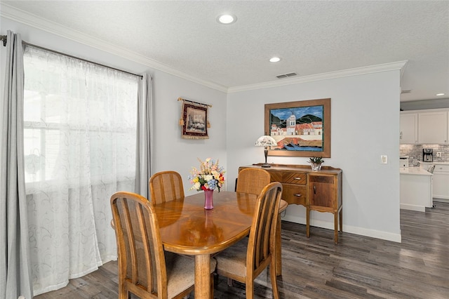 dining area featuring dark wood-style flooring, crown molding, visible vents, and recessed lighting