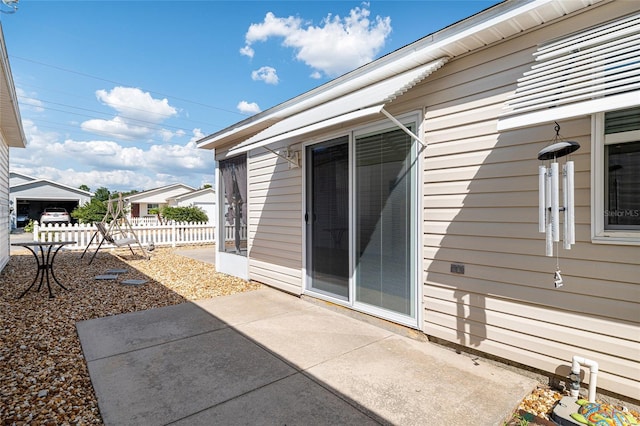 view of patio featuring fence