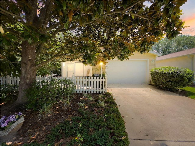 2102 Estevez Dr, Lady Lake, FL 32159 - obstructed view of property featuring driveway