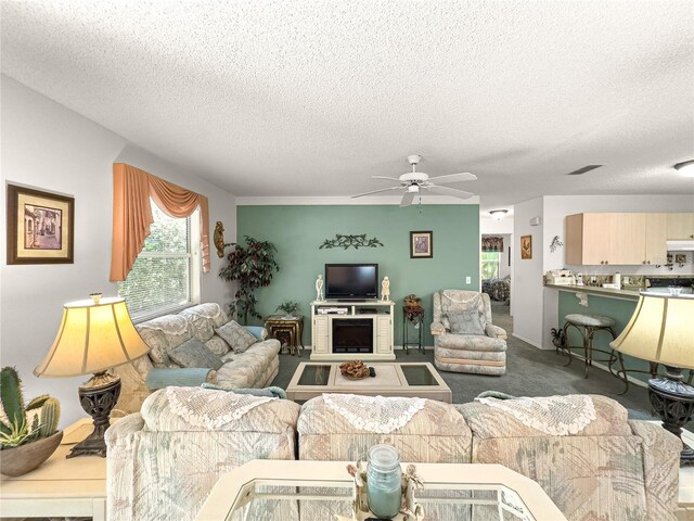 2102 Estevez Dr, Lady Lake, FL 32159 - carpeted living area with a textured ceiling and a ceiling fan