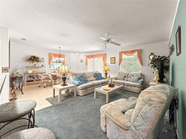 2102 Estevez Dr, Lady Lake, FL 32159 - living area with ceiling fan, a chandelier, and a textured ceiling
