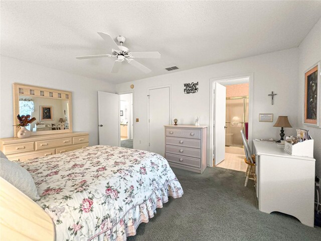 2102 Estevez Dr, Lady Lake, FL 32159 - bedroom featuring light carpet, connected bathroom, and a ceiling fan