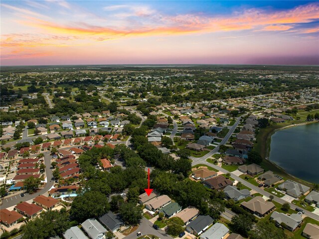 2102 Estevez Dr, Lady Lake, FL 32159 - aerial view at dusk of a water view and a residential view