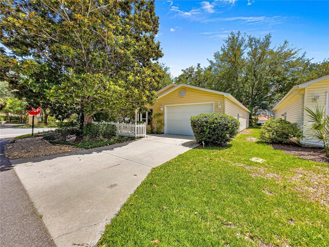 2102 Estevez Dr, Lady Lake, FL 32159 - view of property hidden behind natural elements with driveway and an outdoor structure