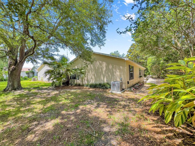 2102 Estevez Dr, Lady Lake, FL 32159 - view of home's exterior with cooling unit