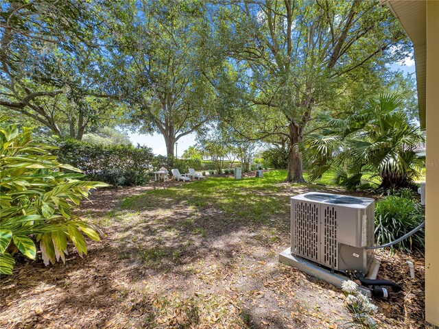 2102 Estevez Dr, Lady Lake, FL 32159 - view of yard with central AC unit