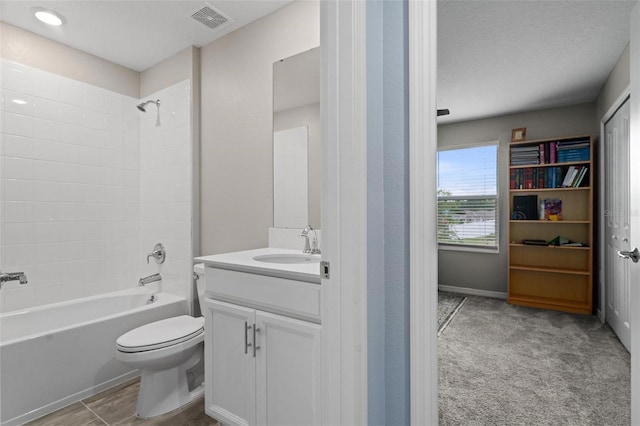 5354 Travertine St, Mount Dora, FL 32757 - bathroom featuring visible vents,  shower combination, toilet, and vanity