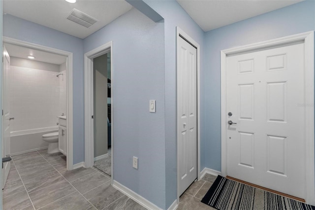 5354 Travertine St, Mount Dora, FL 32757 - foyer entrance featuring baseboards and visible vents