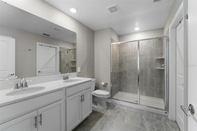 5354 Travertine St, Mount Dora, FL 32757 - full bathroom featuring toilet, visible vents, a shower stall, and a sink