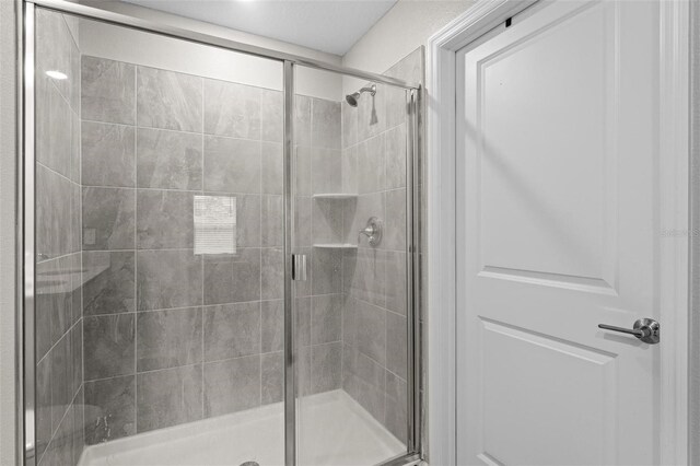 5354 Travertine St, Mount Dora, FL 32757 - bathroom featuring a stall shower