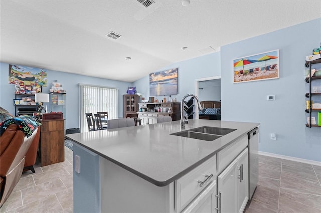 5354 Travertine St, Mount Dora, FL 32757 - kitchen featuring visible vents, open floor plan, white cabinets, a sink, and vaulted ceiling